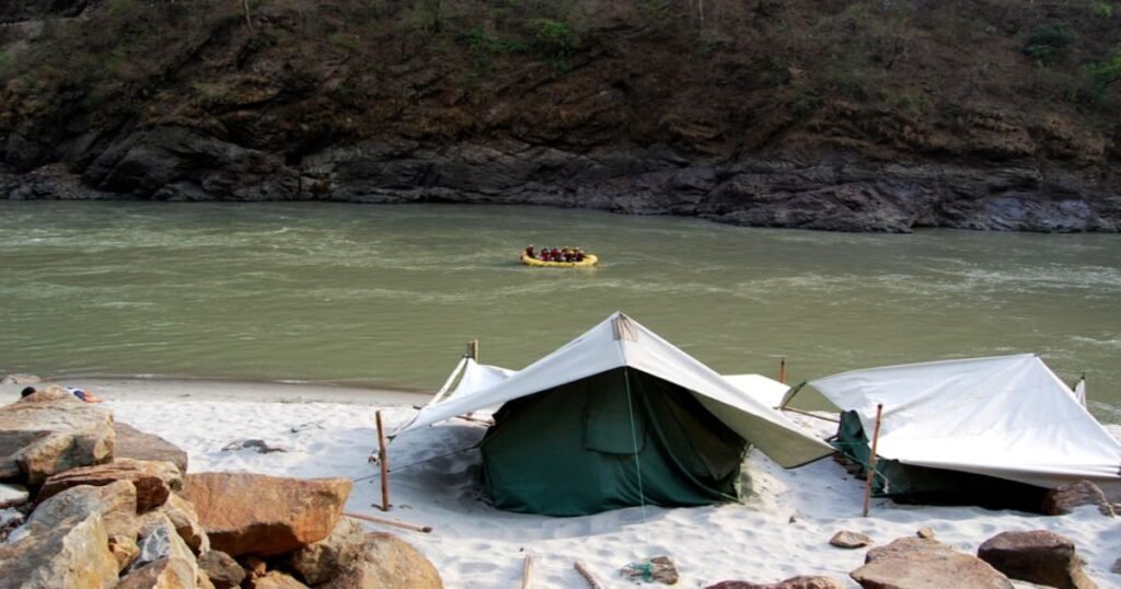 Adventurers enjoying white water rafting on the Ganges River in Rishikesh, India's adventure capital.