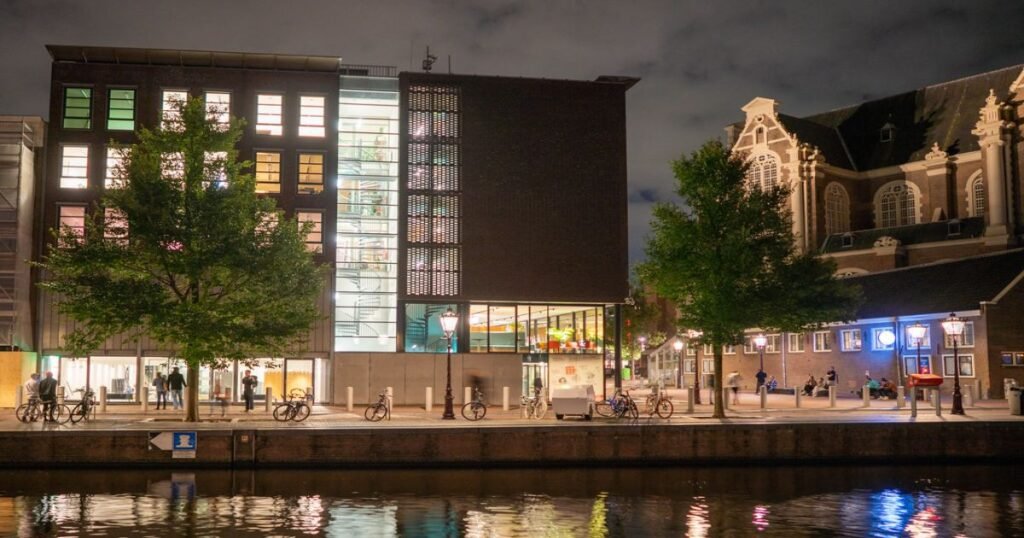 The Anne Frank House along the canal in Amsterdam, with the historical building’s brick façade visible.