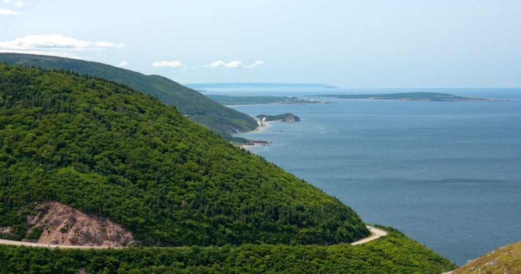 “Hikers overlooking the Atlantic Ocean from the Skyline Trail in Cape Breton Highlands National Park.”
