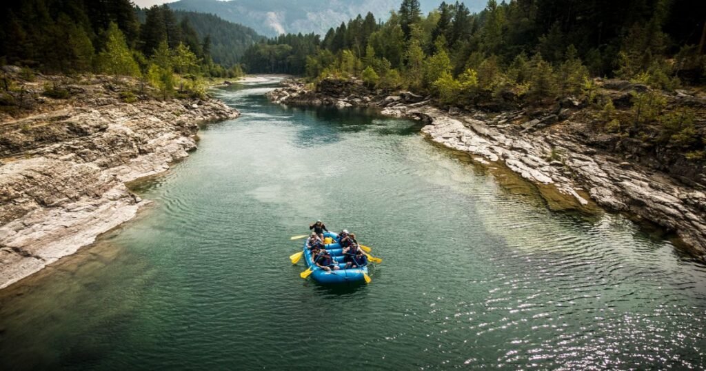  A scenic view showcasing glacier-covered peaks reflecting off tranquil lake waters below.