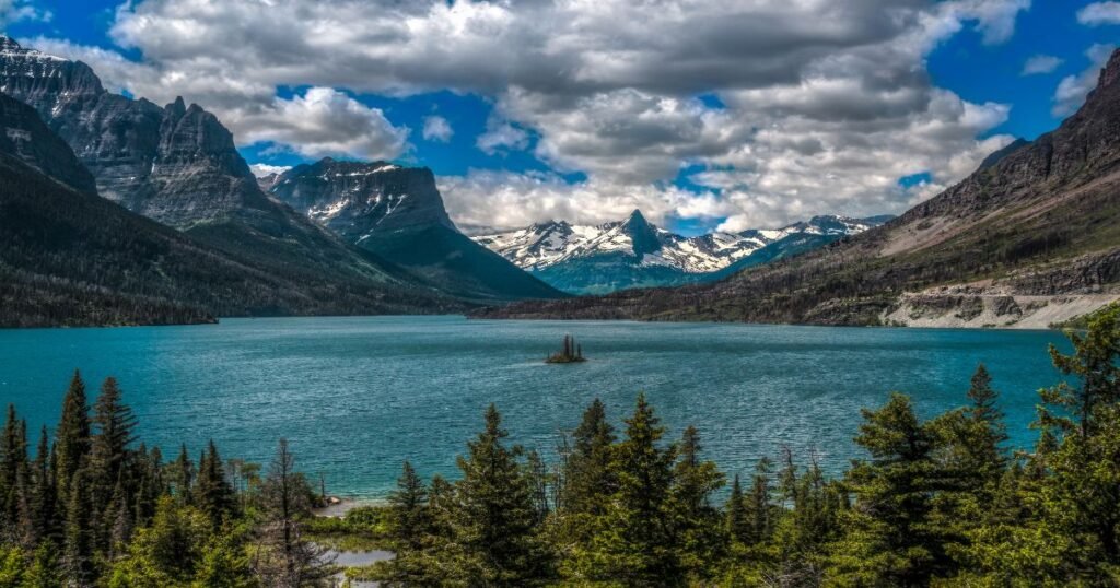 Majestic mountains reflecting off pristine lake waters at Glacier National Park.