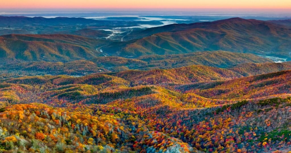 A breathtaking view showcasing rolling mountains enveloped misty clouds highlighting natural beauty surrounding Smokies