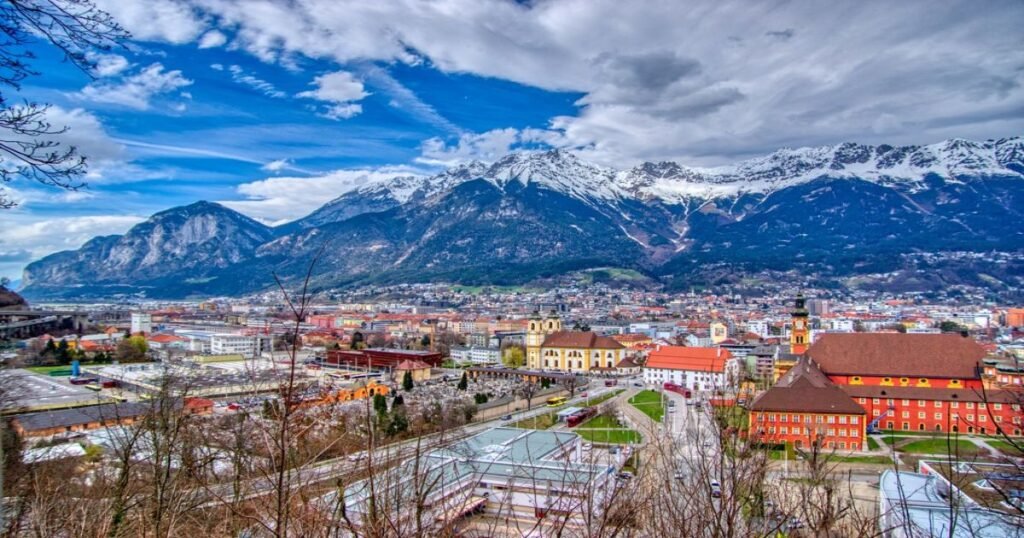 The Golden Roof glistening in the sunlight against the backdrop of the snow-capped Alps in Innsbruck.