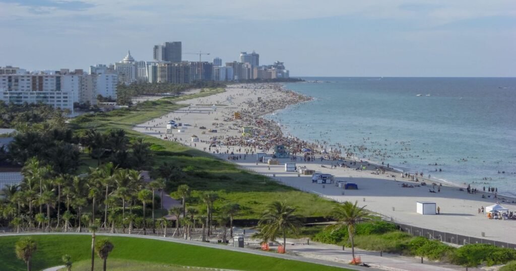 South Beach with colorful Art Deco buildings against a clear blue sky.