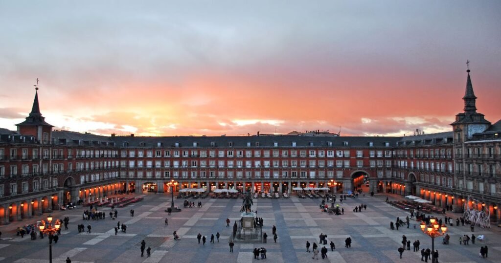 The grand Plaza Mayor square in Madrid with its symmetrical buildings and lively atmosphere.