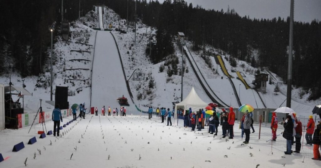 “Skiers navigating the snowy slopes of Schladming-Dachstein with the majestic Dachstein Glacier in the background.”