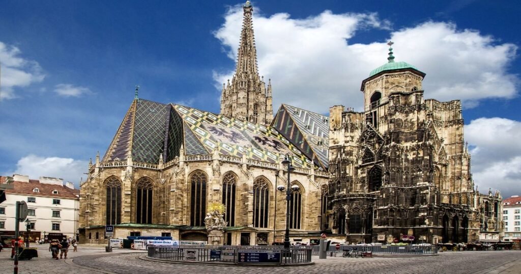  The Gothic towers of St. Stephen’s Cathedral stand tall against a clear blue sky in the heart of Vienna.