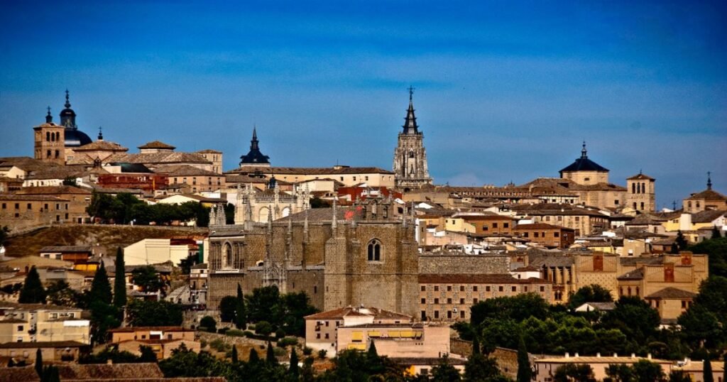 The historic city of Toledo with its medieval buildings perched on a hill overlooking the river.