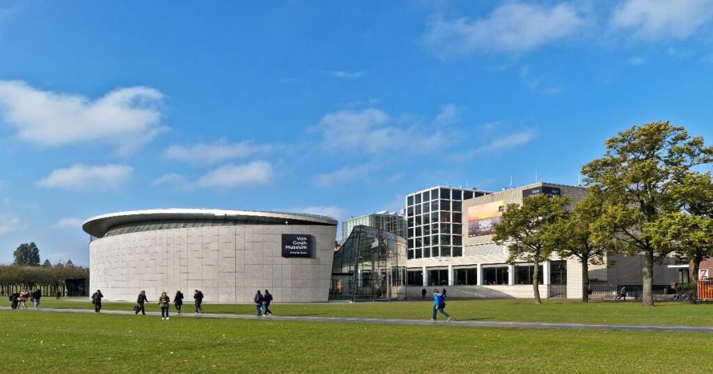 The sleek modern exterior of the Van Gogh Museum against the blue sky in Amsterdam’s Museumplein.