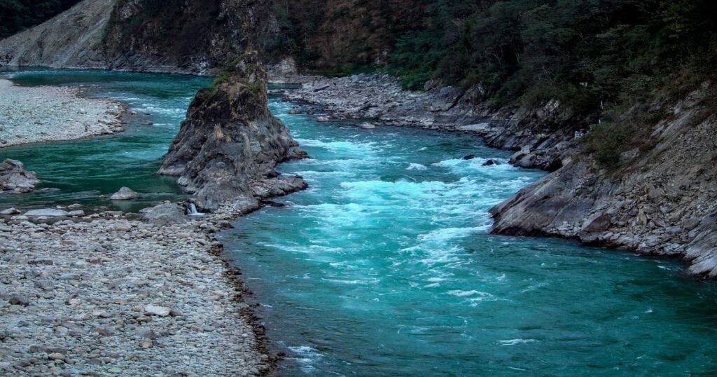 Adventurers rafting on pristine rivers surrounded by untouched wilderness in Arunachal Pradesh's Eastern Himalayas.