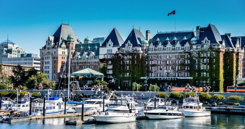 Charming waterfront view showcasing boats docked against backdrop historic buildings Victoria .
