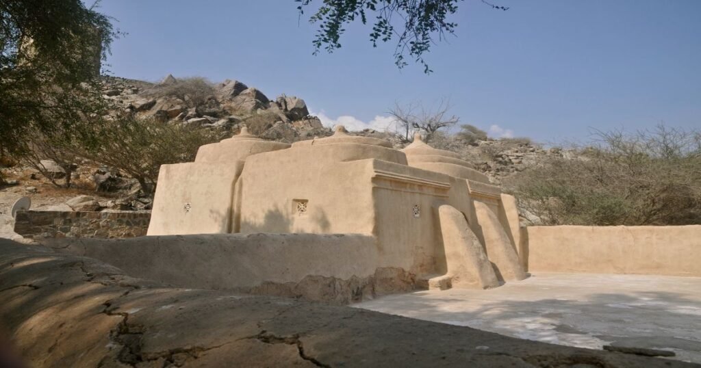 "The ancient Al Bidya Mosque in Fujairah, showcasing its simple stone structure and historical significance."