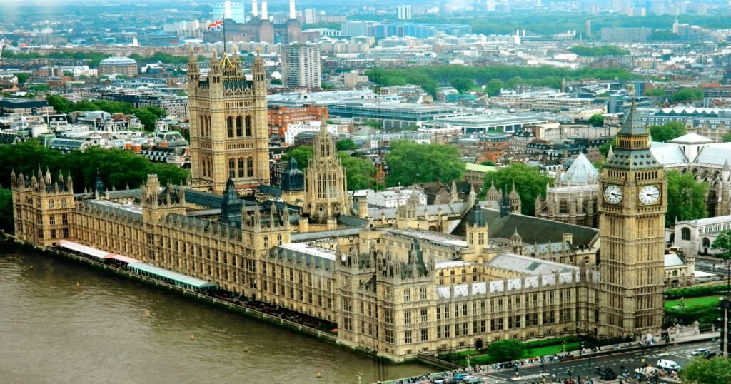 “Big Ben and the Houses of Parliament at sunset, with the River Thames in the foreground.”