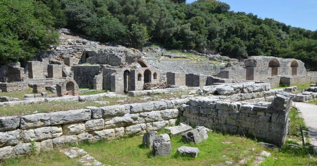 "Ancient ruins of Butrint surrounded by green landscapes in Butrint National Park."