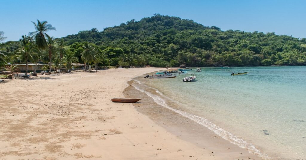 “Pristine waters of Coiba National Park, with a lush, green island in the background.”