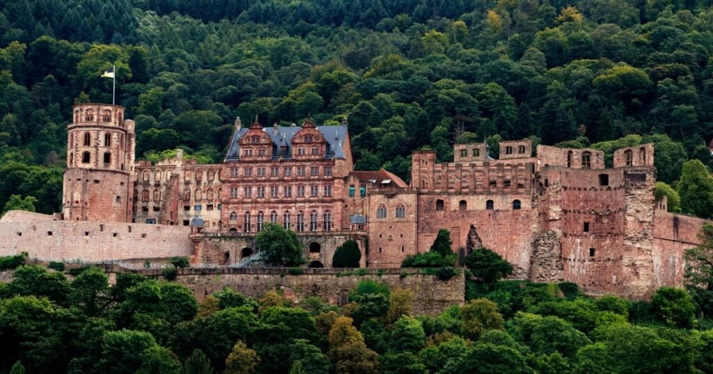 The majestic Heidelberg Castle overlooking the scenic town of Heidelberg and the Neckar River."