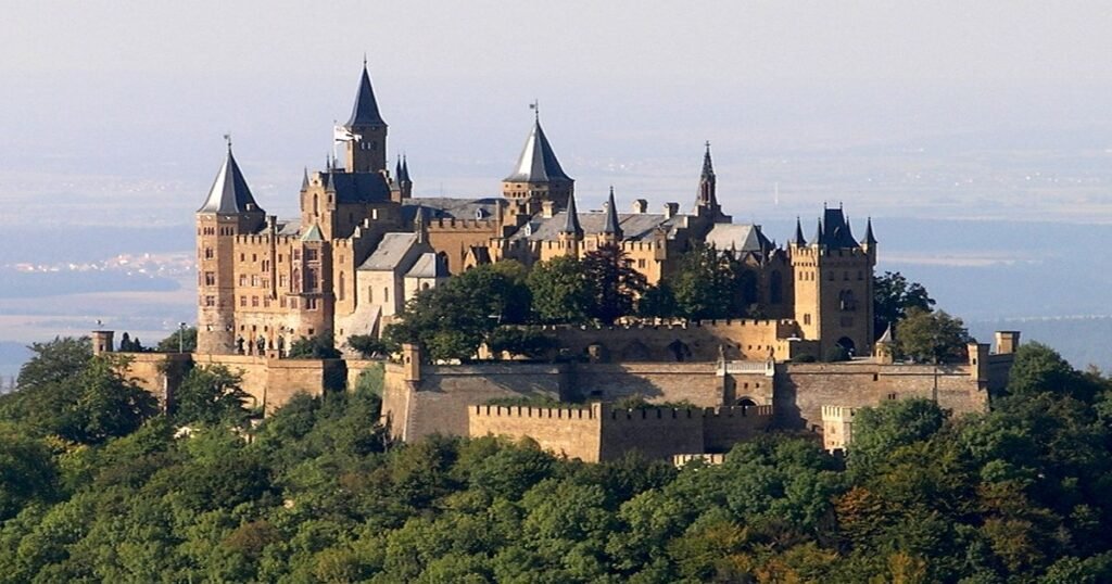 Hohenzollern Castle, a stunning neo-Gothic castle perched on a hilltop, with panoramic views of the Swabian Alps.