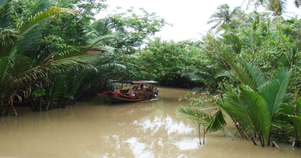 "Colorful boats at the Cai Rang Floating Market in the Mekong Delta, filled with fresh produce and goods."