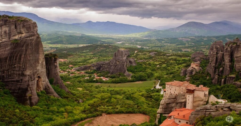 "Monasteries of Meteora perched on rocky cliffs surrounded by lush greenery."