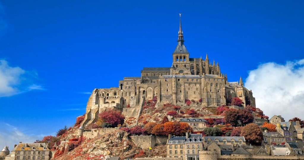 Mont Saint-Michel rising above its tidal surroundings, with the abbey’s spires visible from afar.