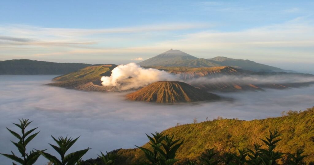 "Sunrise over Mount Bromo with mist in the Tengger Caldera."