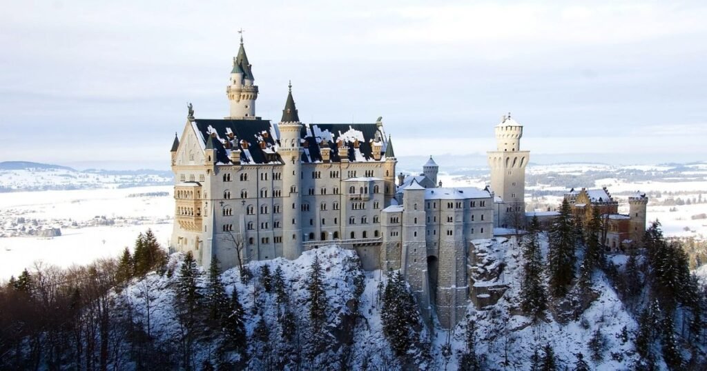 Neuschwanstein Castle in Bavaria, a fairy-tale castle set against the lush greenery of the Bavarian Alps."