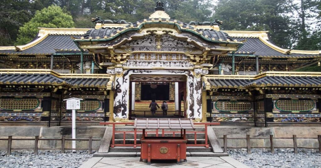 "The richly adorned Yomeimon Gate at Nikko Toshogu Shrine, with intricate carvings and gold leaf accents."