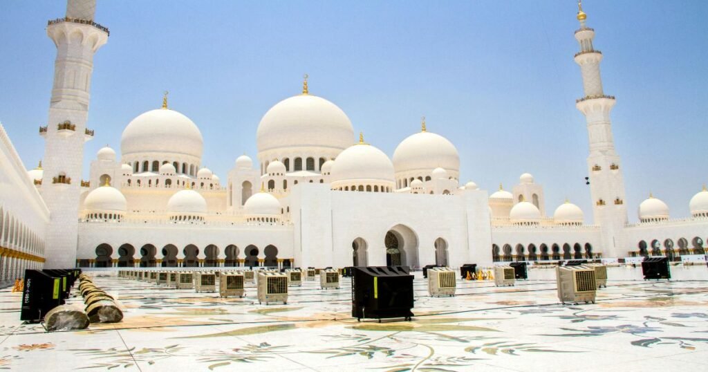 "The magnificent Sheikh Zayed Grand Mosque in Abu Dhabi, showcasing white domes and towering minarets."