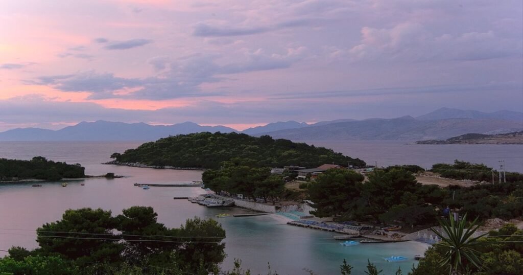 "Sandy beach with turquoise waters along the Albanian Riviera."