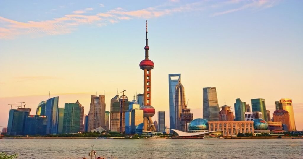 "The Bund in Shanghai with historic colonial buildings and a modern skyline in the background."