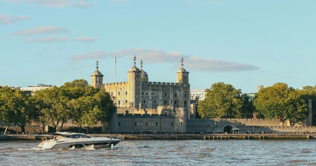 “The iconic Tower of London, a historic fortress with medieval architecture, overlooking the River Thames.”