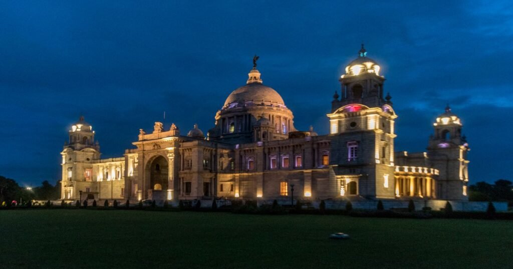 “Victoria Memorial’s white marble structure, illuminating in the night''