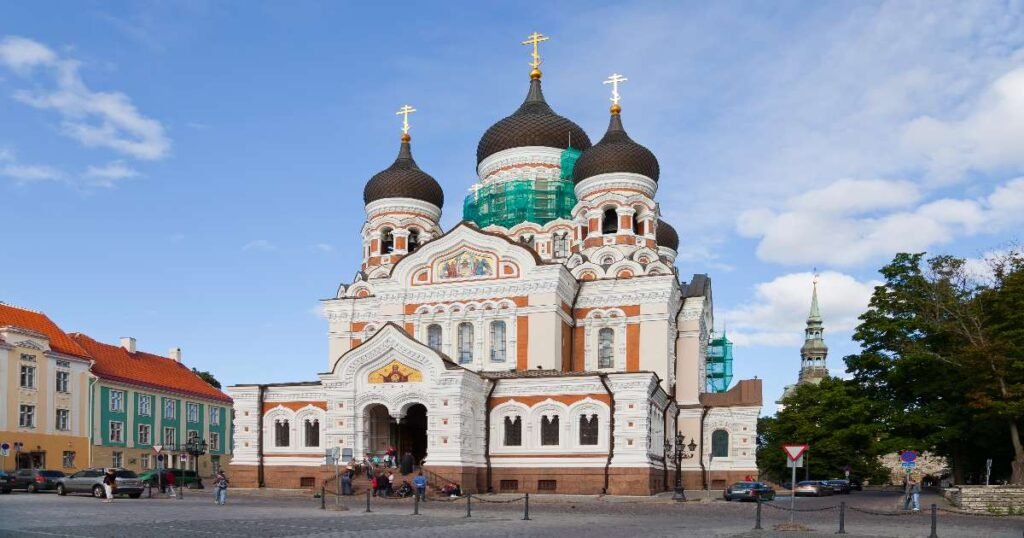 “Elegant Baroque architecture of the Alexander Nevsky Monastery with surrounding trees in Saint Petersburg.”