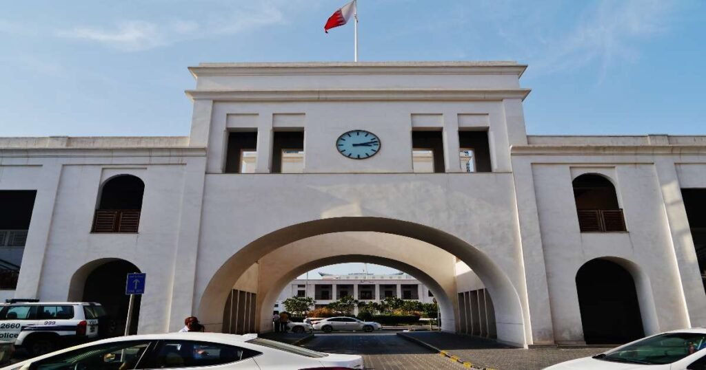 Bab Al Bahrain historical building with traditional arches and market stalls in Bahrain.