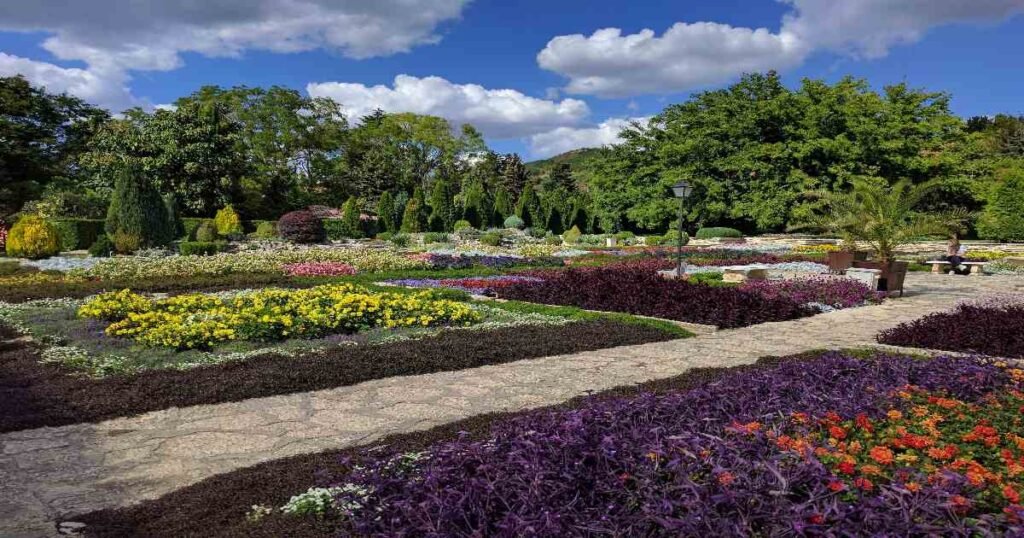 "The Balchik Palace with colorful botanical gardens in the foreground, overlooking the Black Sea."