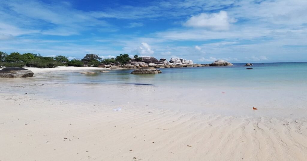 “Granite rock formations and clear waters on the beaches of Bangka-Belitung Islands.”