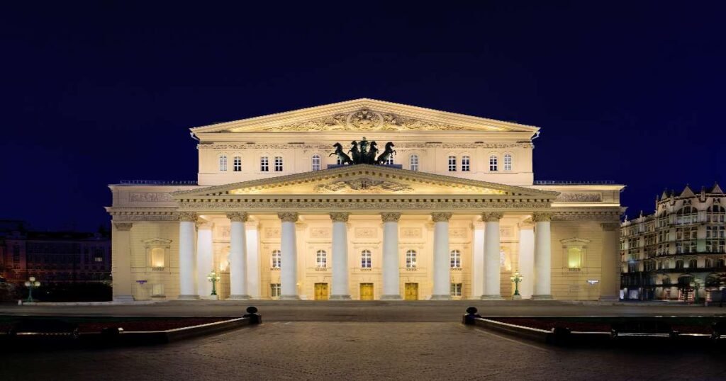 “Historic grandeur of the Bolshoi Theatre illuminated at night in Moscow.”