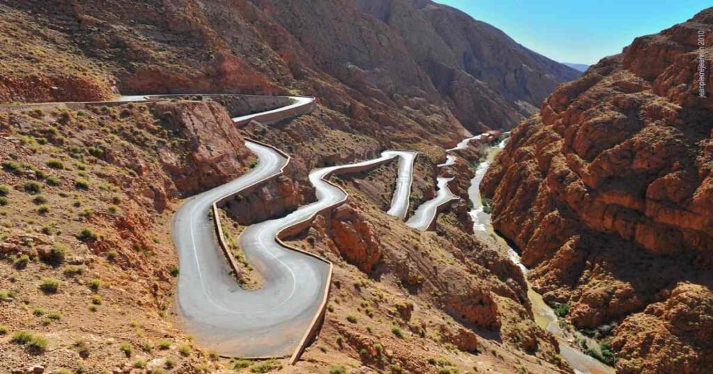 “Steep cliffs and winding roads in Dades Gorge with dramatic rock formations.”