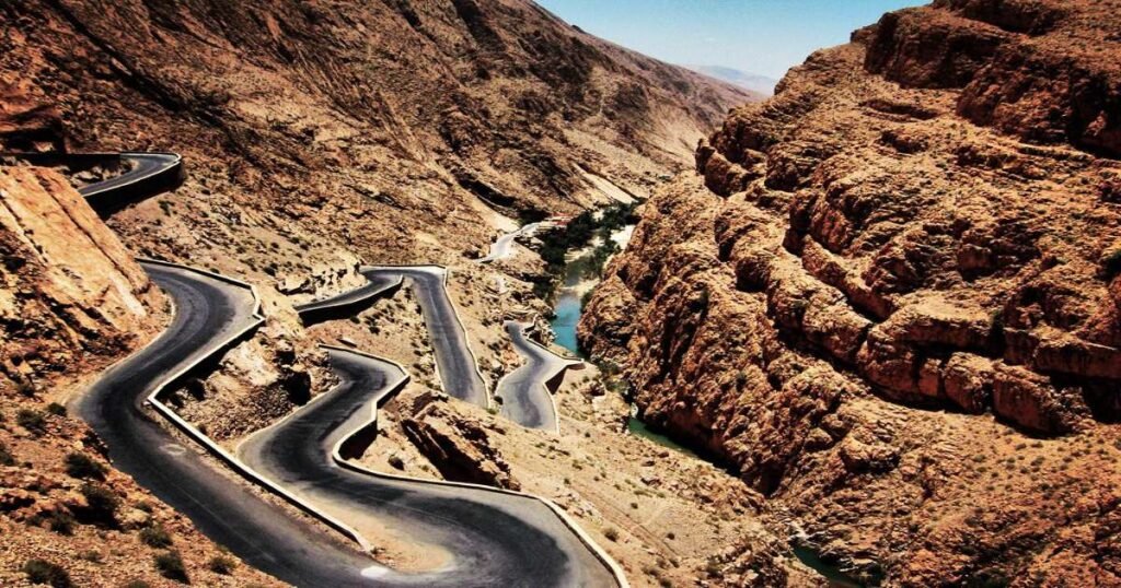 "View of the winding road and dramatic rock formations in the Dades Valley."