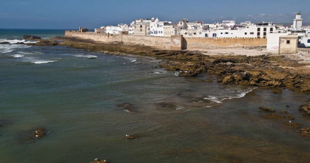 "Essaouira’s sandy beaches with fortified walls."