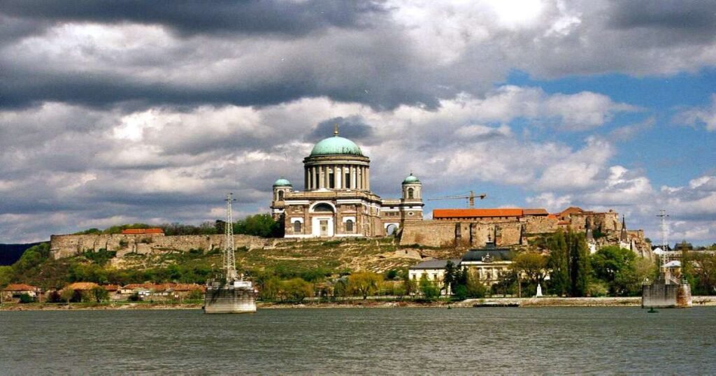 "Majestic Esztergom Basilica with its grand dome overlooking the Danube River."