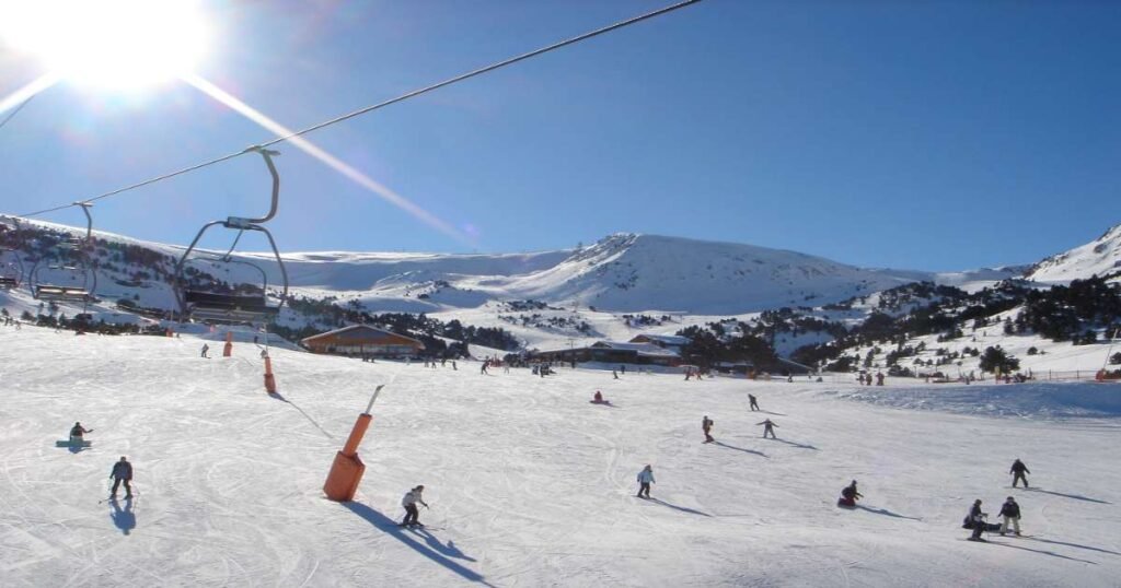 “Snow-covered slopes and skiers at Grandvalira Ski Resort with scenic mountain views.”