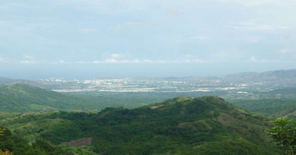 “Aerial view of lush green mountains of Minca.”