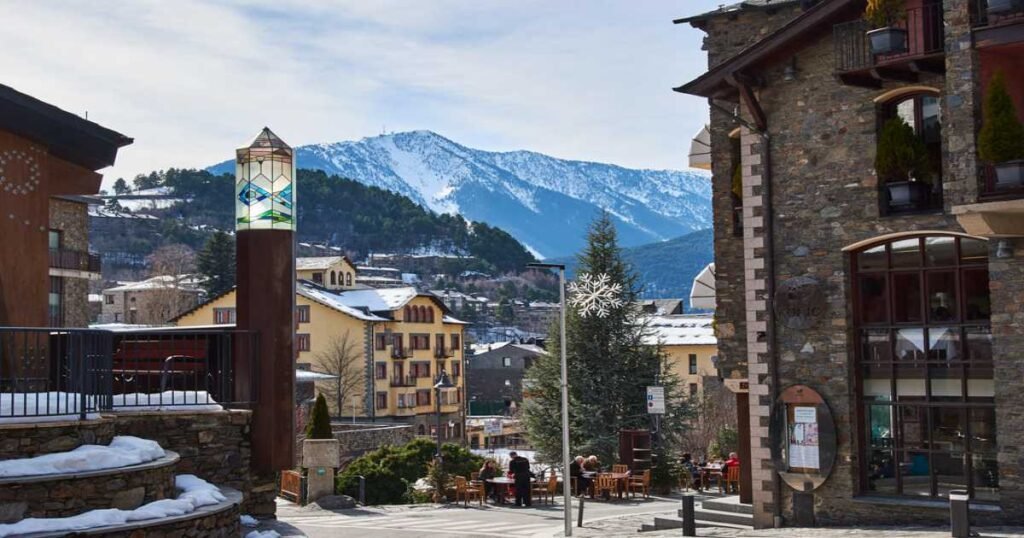 Traditional stone buildings and mountain backdrop in the village of Ordino, Andorra.