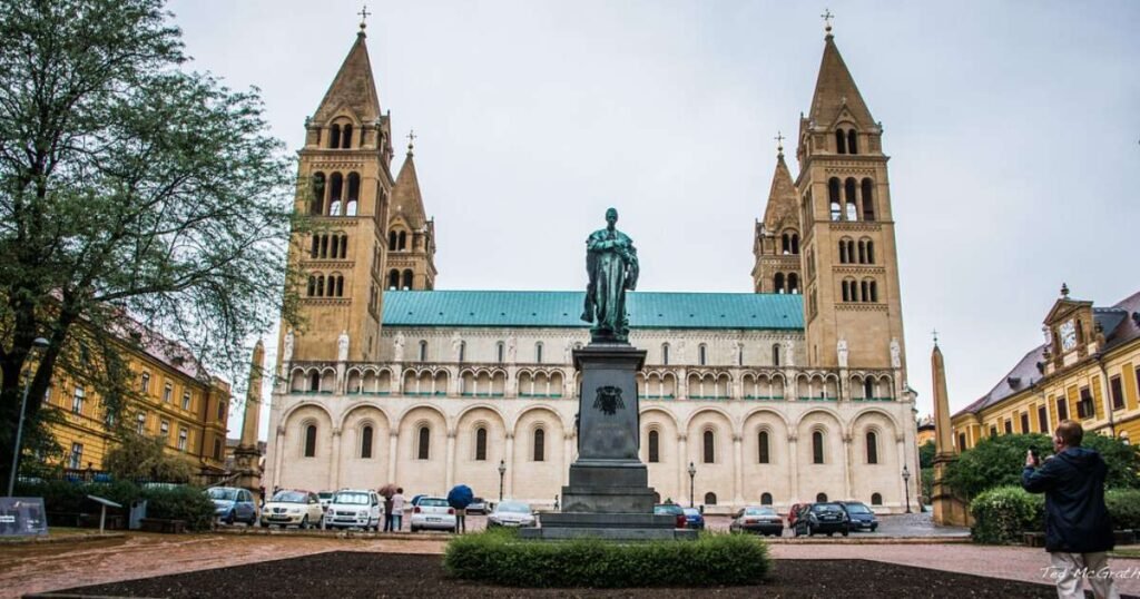 "Romanesque Pécs Cathedral with its tall spires and intricate stonework in Hungary."