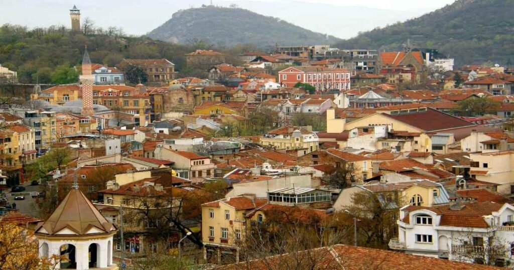 “Ancient Roman theater in Plovdiv Old Town with colorful Revival-era houses on the hills.”