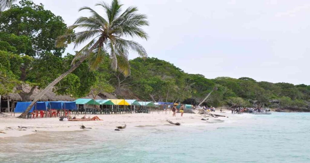 “Turquoise waters and white-sand beaches of Rosario Islands with boats anchored nearby.”