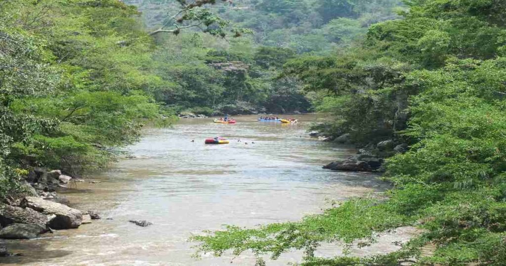 “Rafters navigating through white-water rapids on the Río Fonce near San Gil.”