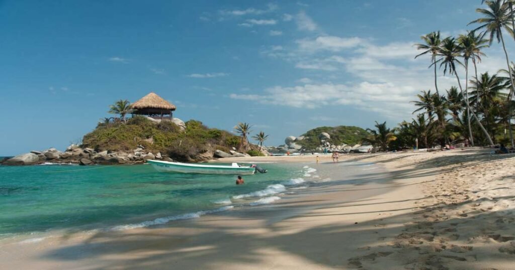 "White sandy beach and turquoise waters at Tayrona National Park."