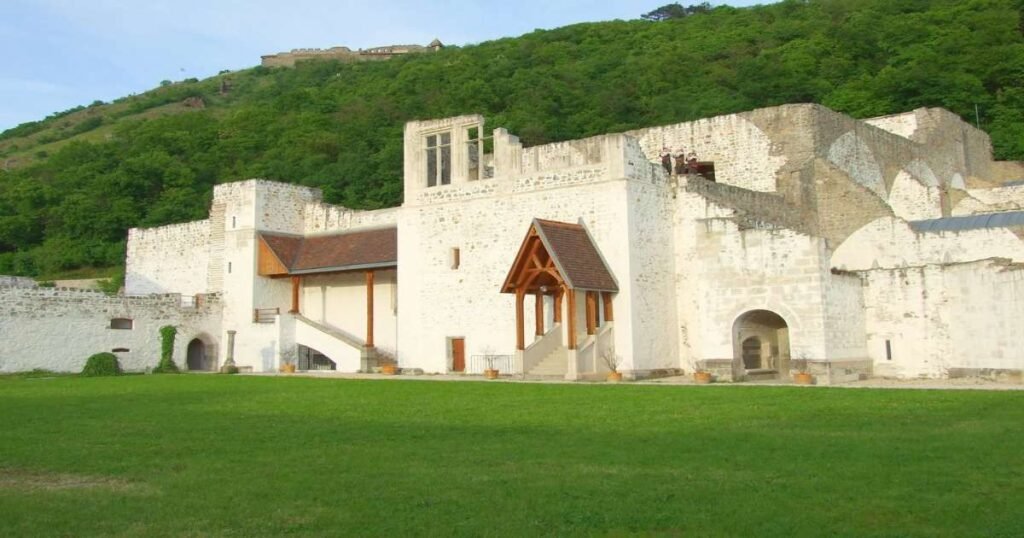 "Stone ruins of Visegrád Castle on a hilltop overlooking the scenic Danube Bend."